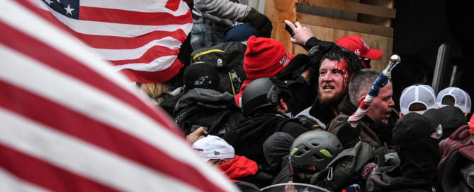 A mob egged on by U.S. President Donald Trump clashes with police at the west entrance of the Capitol in Washington on Jan. 6.